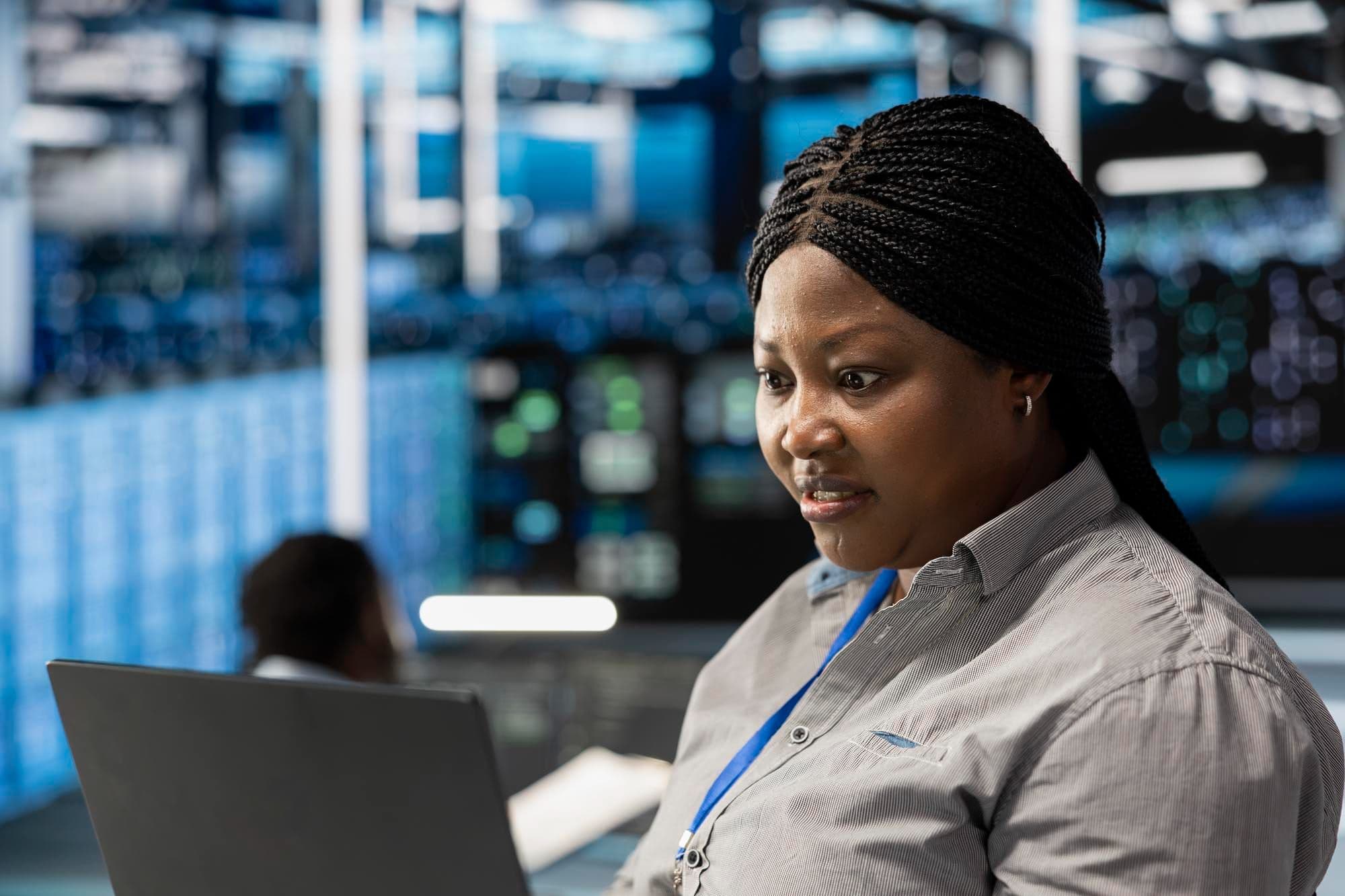 Security operations analyst reviewing risk and compliance work